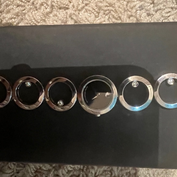 Silver Movado watch with six diamonds. main image 4